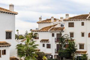 Typical Canary style holiday apartments and tropical plants. Roof Tiles