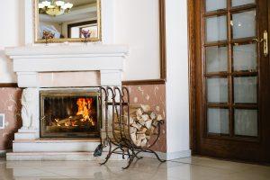 Elaborate Fireplaces. Beautifully decorated fireplace with fire in it in the living room