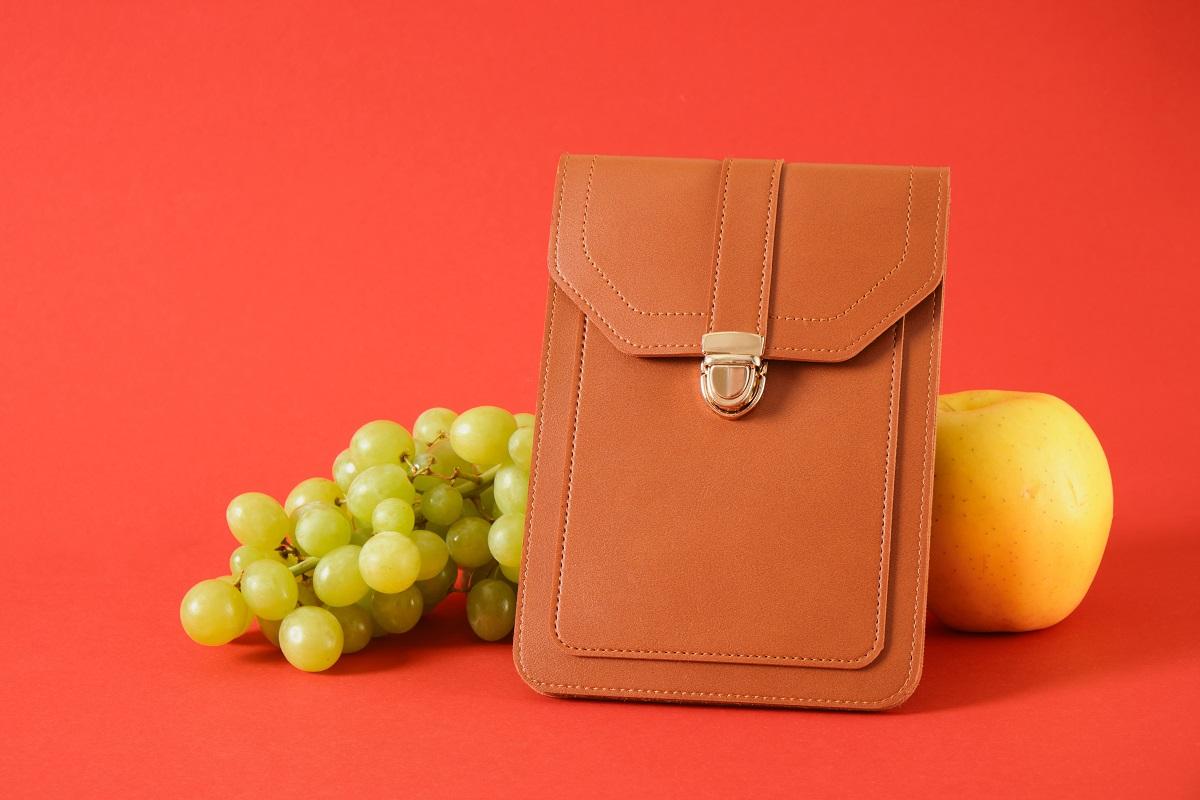 brown bag made from alternative material made from winery waste, apple peel and peel of other fruits for leather making, vegan leather concept. Best Glue for Faux Leather.