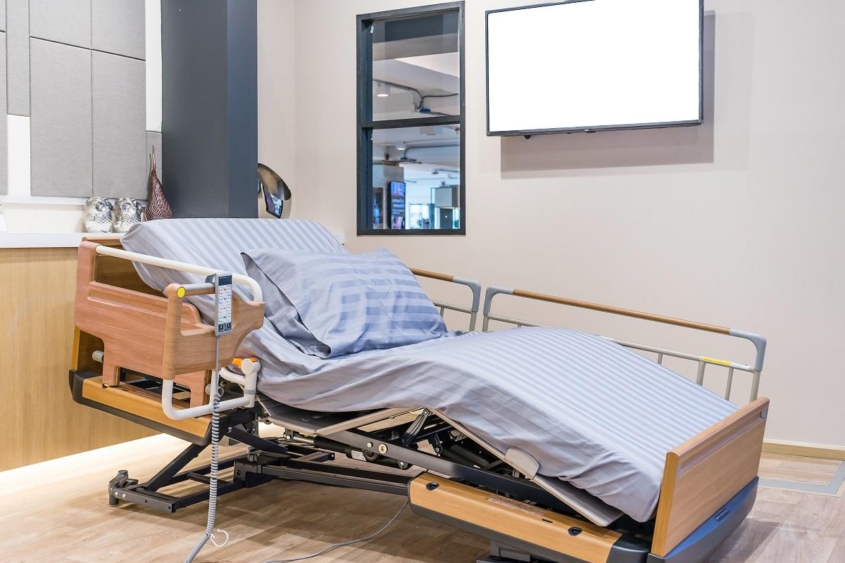 Electrical adjustable patient bed in hospital room. Technology of medical and hospital services. Adjustable Beds.