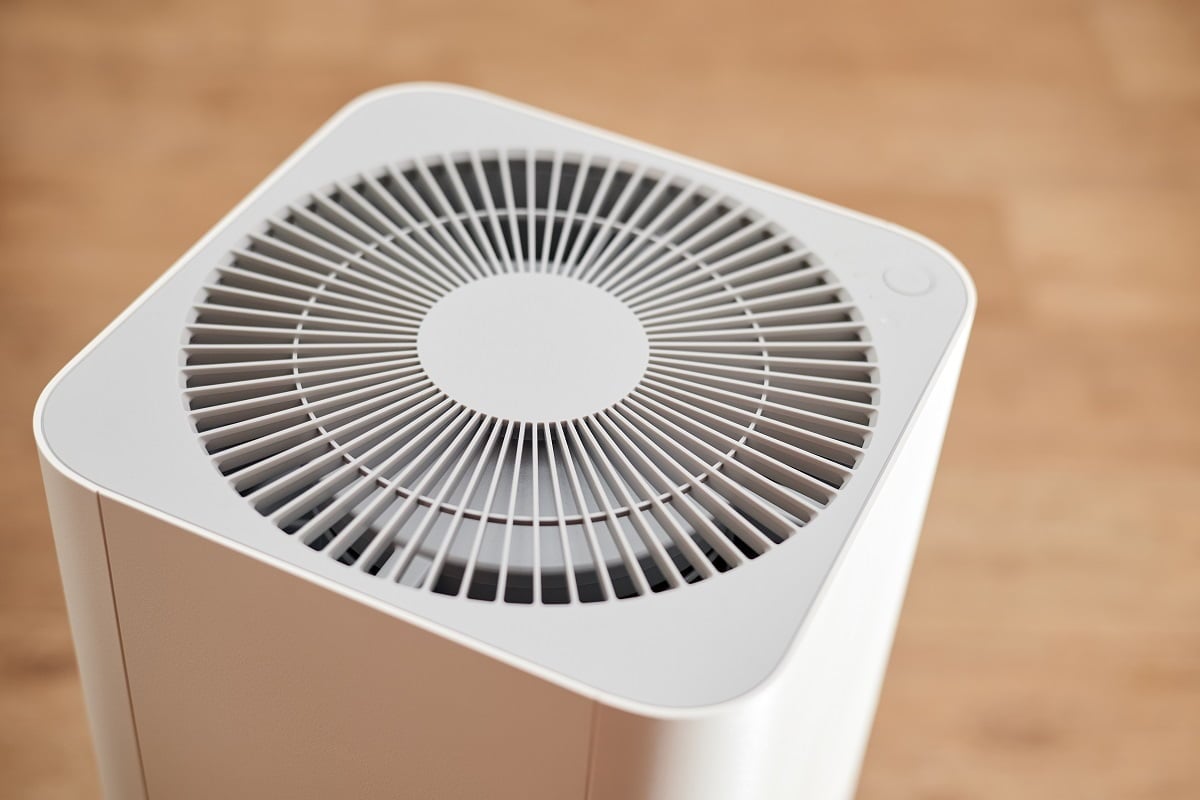 White air purifier in an apartment. Close-up, selective focus. Benefits Of A Dehumidifier In Bedroom Final Words.