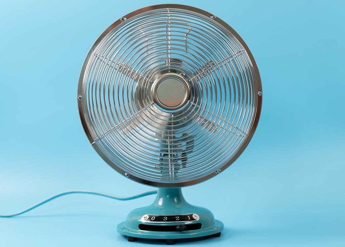 Retro vintage tabletop fan isolated on a blue background. Difference Between A Fan And A Blower Fan.
