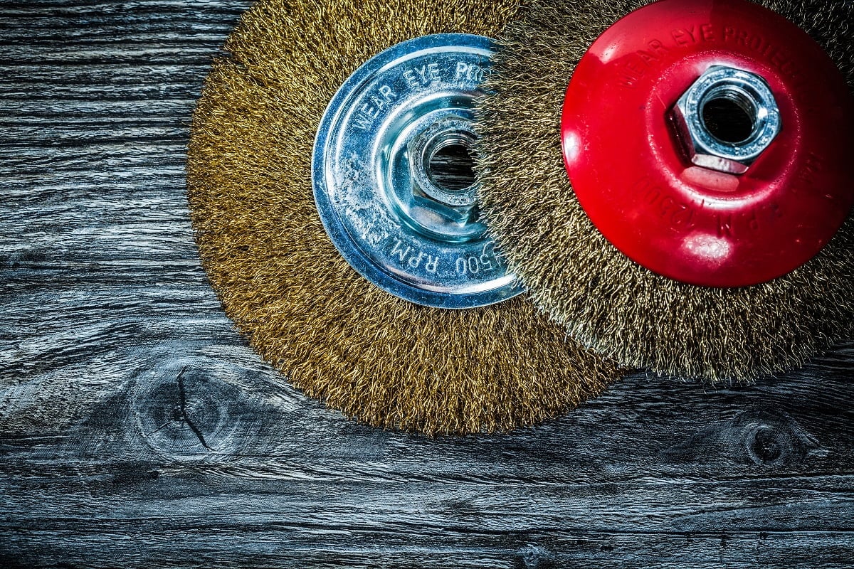 Brass wheel brushes on vintage wooden board. What Are Angle Grinder Wire Wheels.