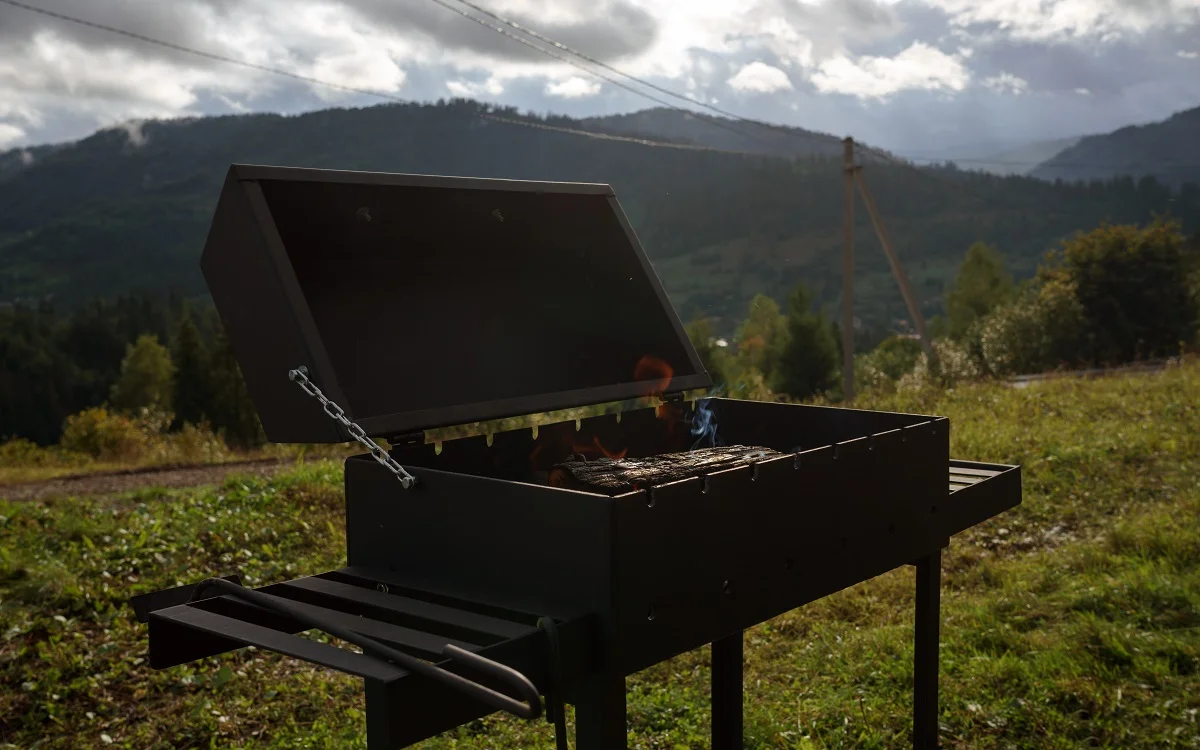 Fire in barbecue grill with mountain view. How To Build An Insulated BBQ Smoker Conclusion.