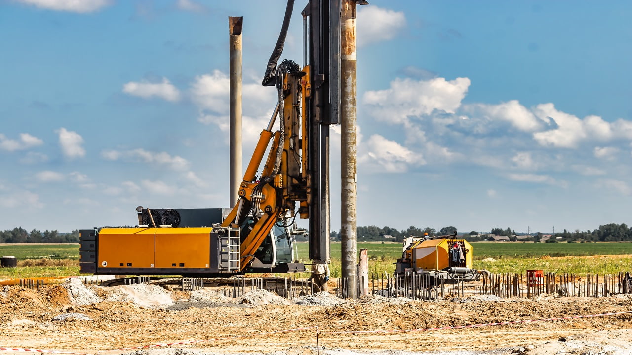 Powerful hydraulic drilling rig at a construction site. The device of pile foundations. Bored piles. Heavy construction equipment. Pile Driving Machine.