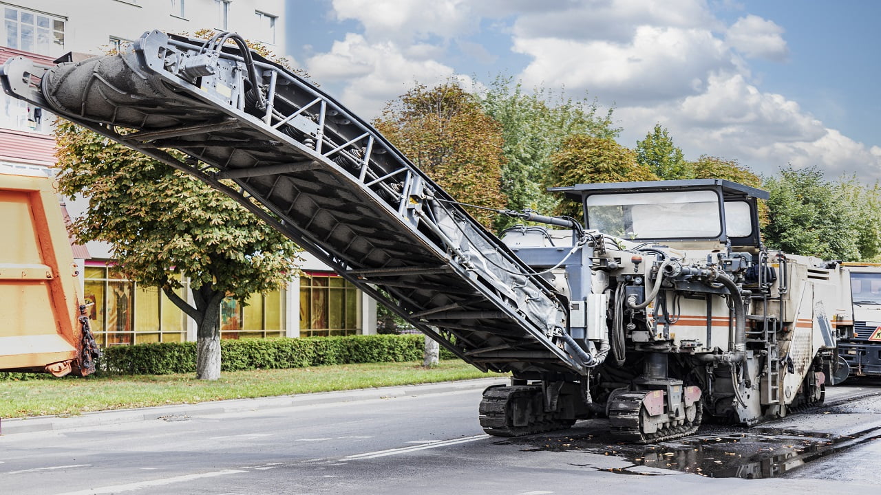A special machine cuts the asphalt. The technician removes the old asphalt and loads it into a dump truck. Road repair, asvalt replacement, construction work. Types Of Heavy Construction Equipment Final Words.