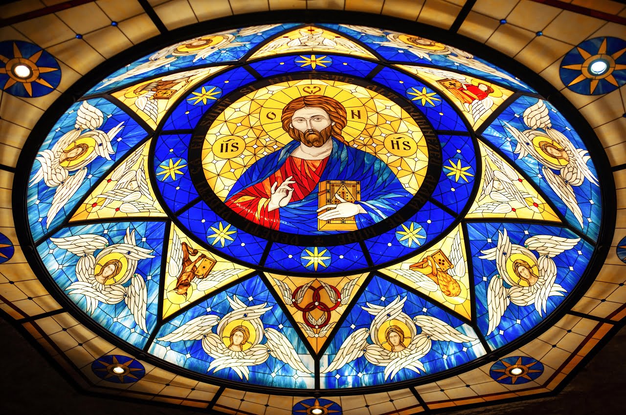 Stained glass roof in a church with the image of Jesus. What Is Stained Glass?