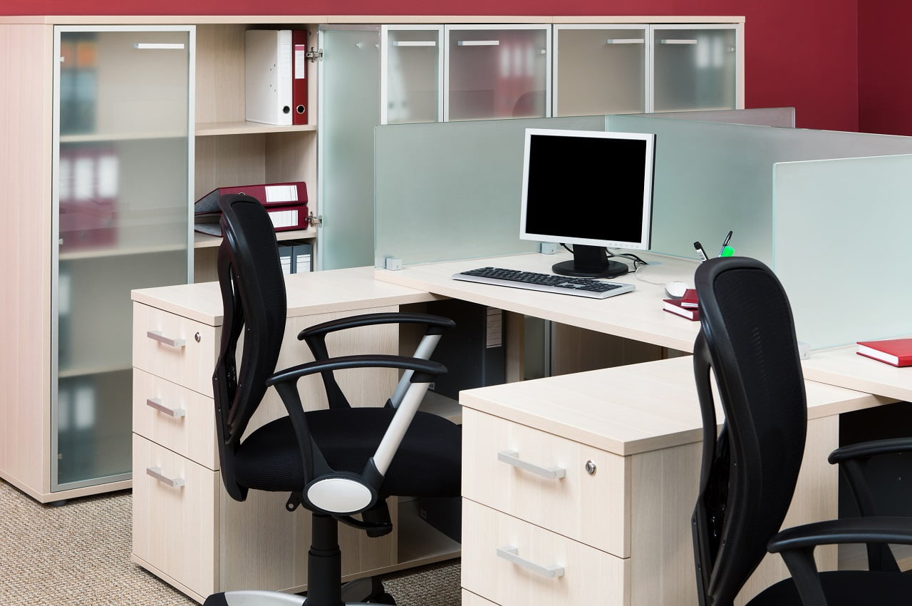 computers behind the glass in a modern office. Easy Cubicle Decor Ideas For Personalizing Your Work Area.