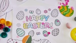 Background image of Happy Easter coloring book on art and craft table at Easter party for children, copy space. DIY Easter Drawing Ideas