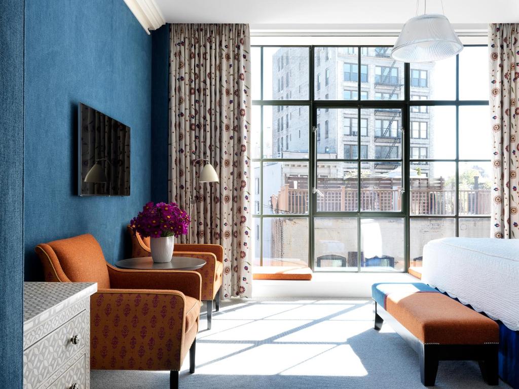 Crosby Street Hotel Interior Featuring Blue Accent Wall and Steel Casement Windows © Crosby