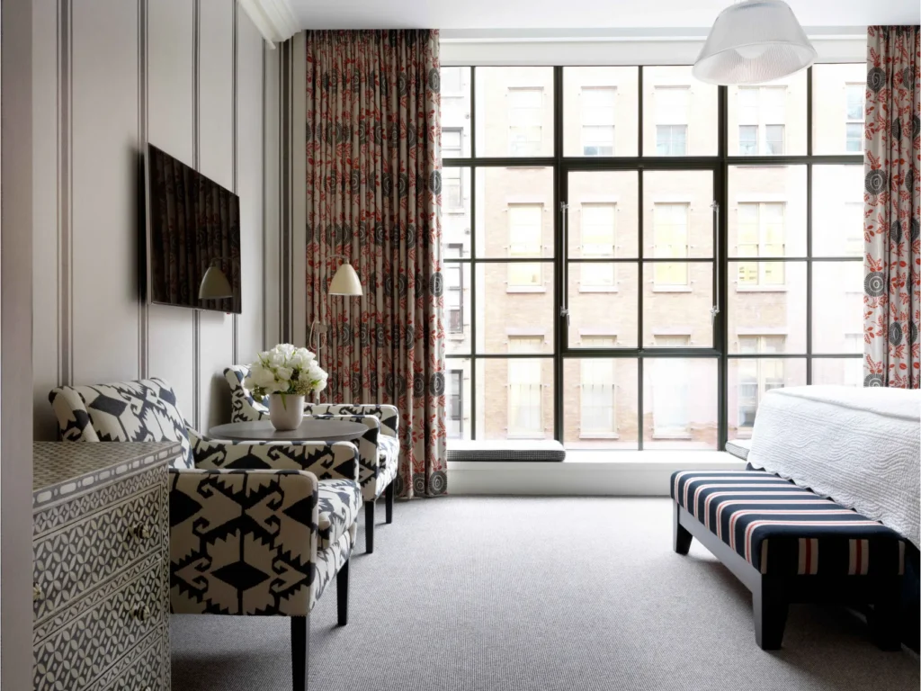 Crosby Street Hotel Interior Featuring Blue Accent Wall and Steel Casement Windows © Crosby