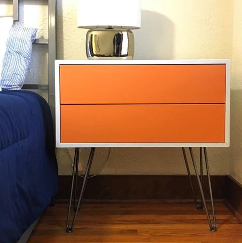 Orange two-drawer mid-century modern nightstand with hairpin legs 